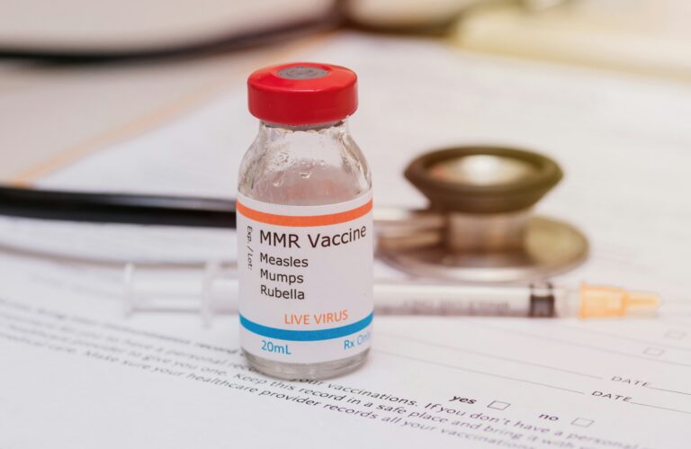 measles mumps and rubella (MMR) vaccination concept, vaccine on doctors desk