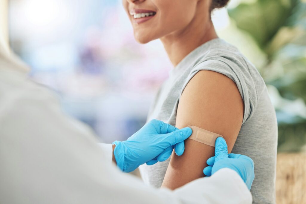Band aid, vaccine or injection for covid and global virus in security, safety or wellness insurance